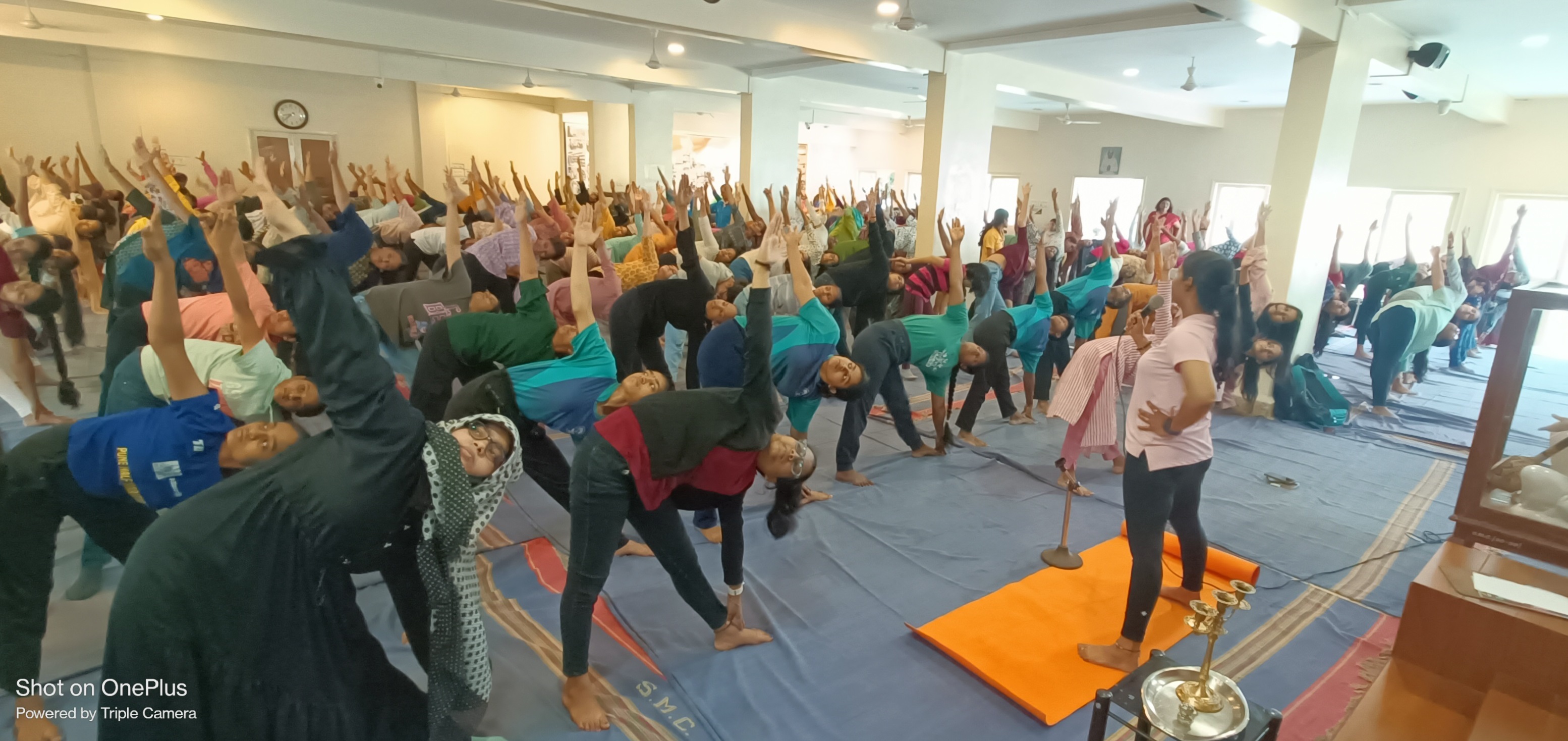 International Yoga Day 2024_ Students performing Trikonasana